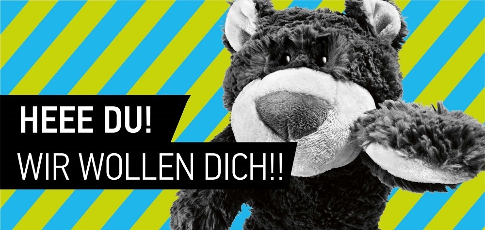 Wolle Wolfsburg und der Schriftzug "Heee Du! Wir wollen Dich!"