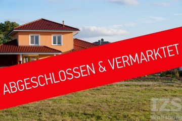 Haus im Baugebiet Heidkamp-Süd und Störer mit der Aufschrift: Abgeschlossen und Vermarktet