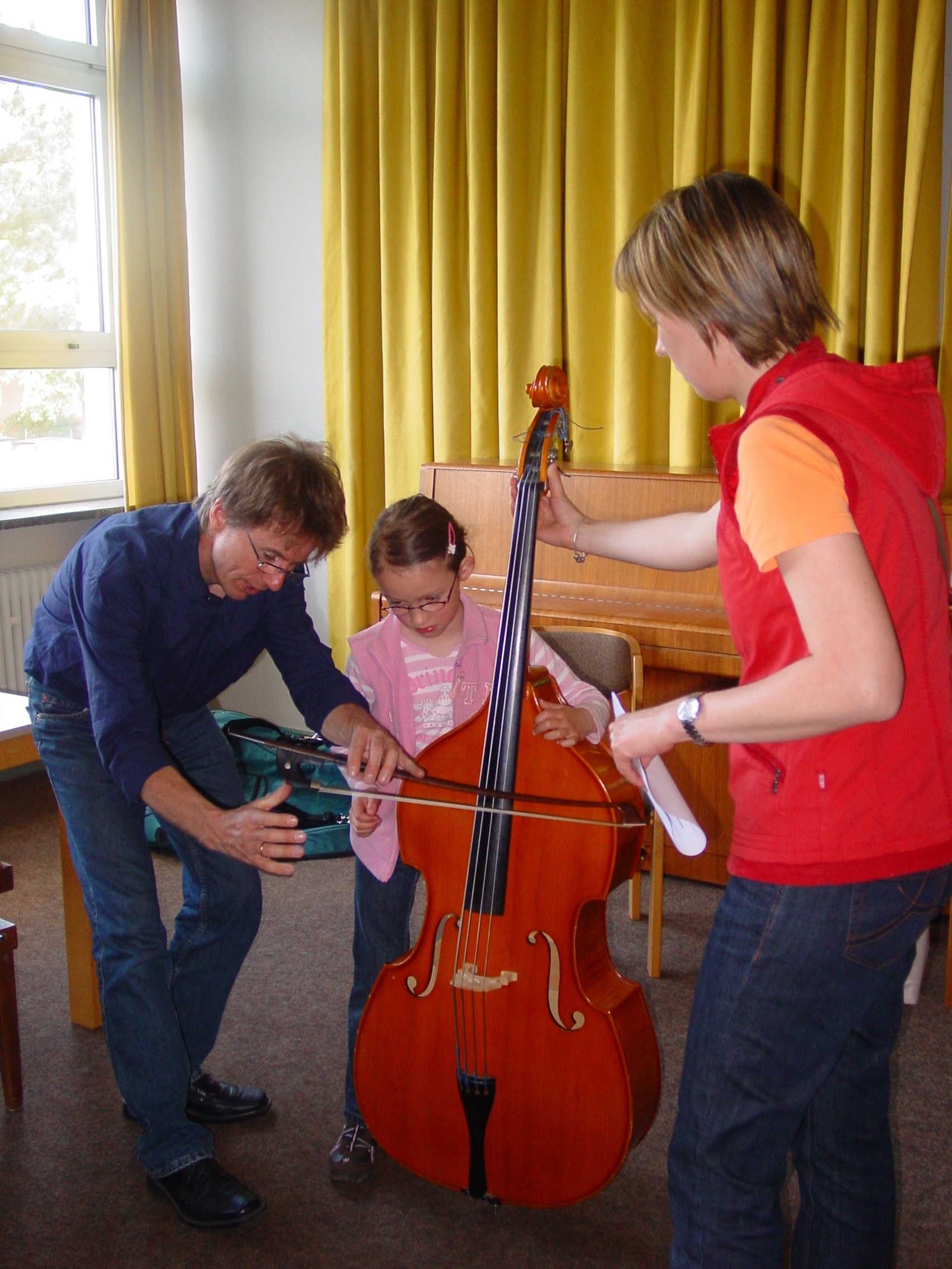 Person teaching double bass
