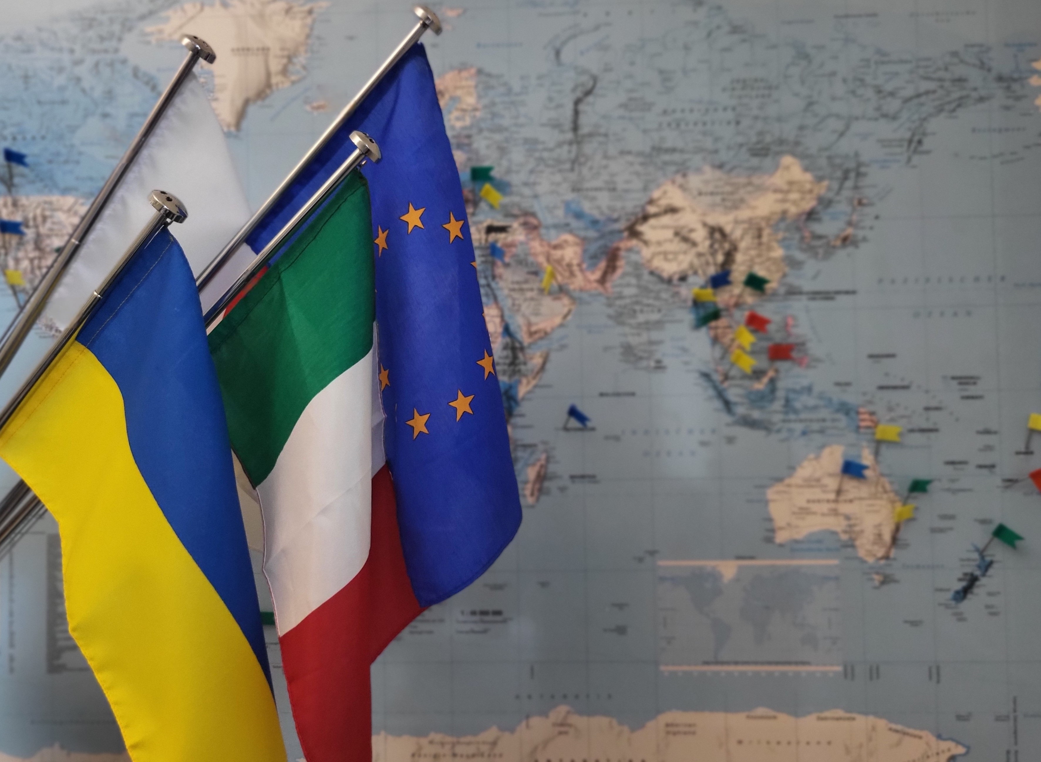 Flags in front of a world map