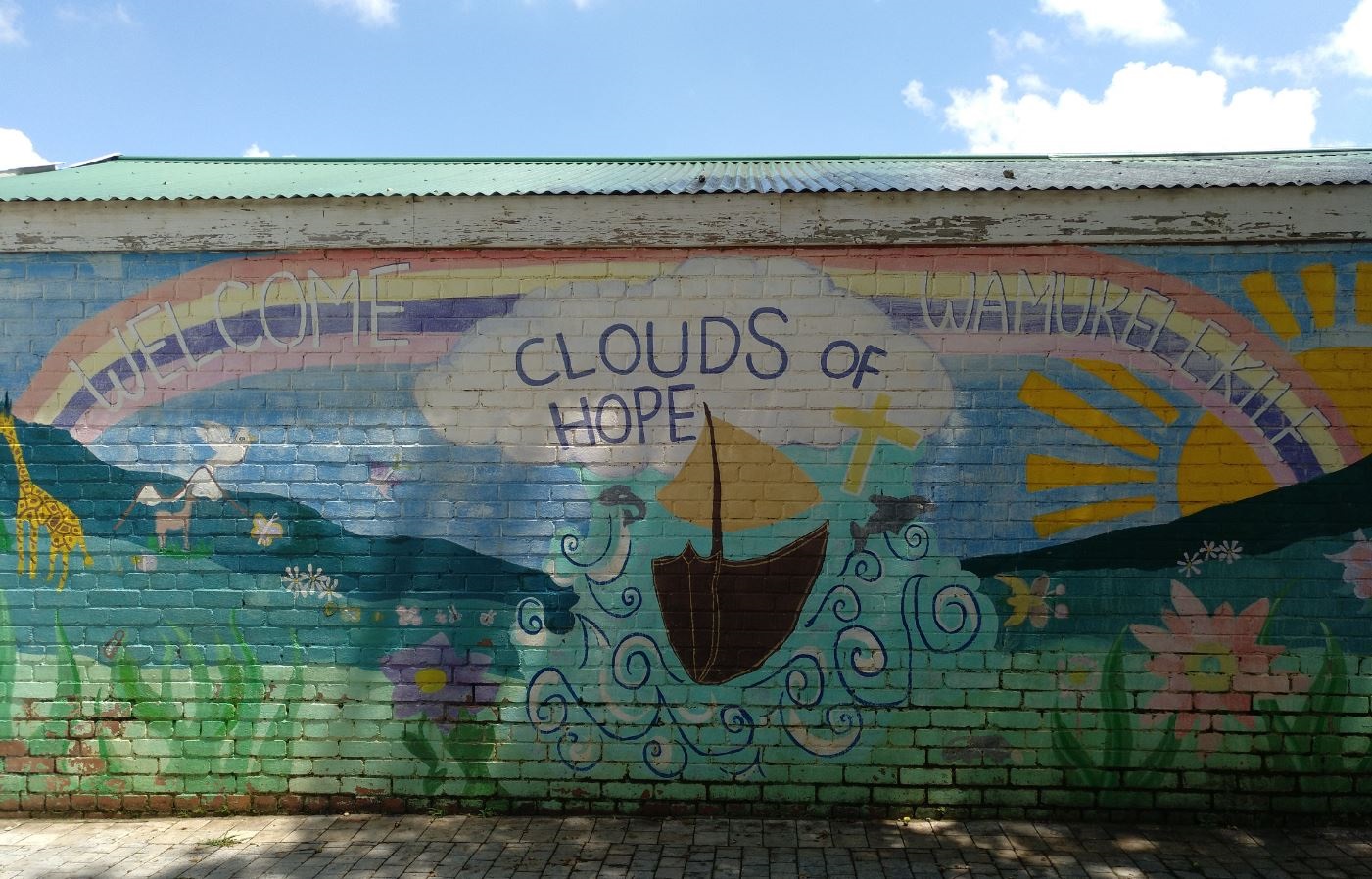 Wandgraffiti mit Schriftzug: Clouds of Hope