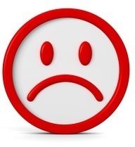 Ein roter Smiley mit einem Gesicht mit heruntergezogenen Mundwinkeln; Foto: fotomek/Fotolia.com