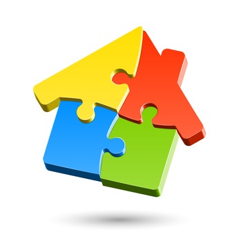Ein Haus aus Puzzleteilen zusammengesetzt