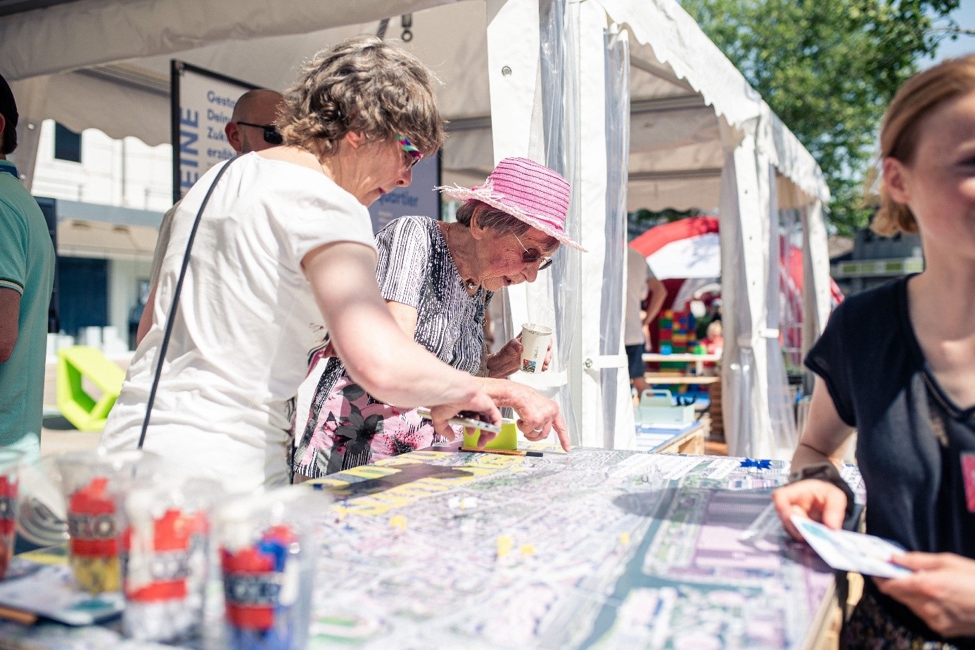 People inform themselves at a stand