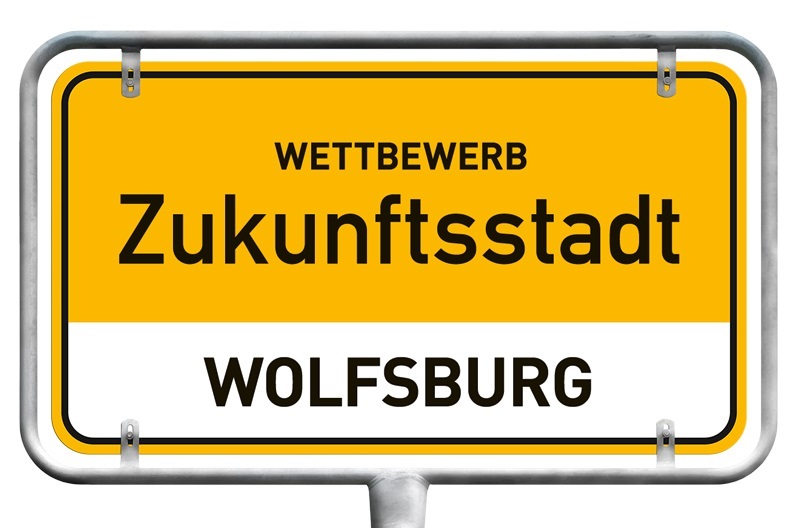 Ortsschild mit der Aufschrift "Wettbewerb Zukunftsstadt: Wolfsburg"